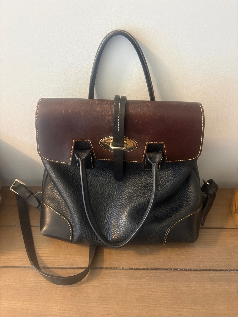 Dooney & Bourke Black Pebbled Leather Backpack with Brown Flap